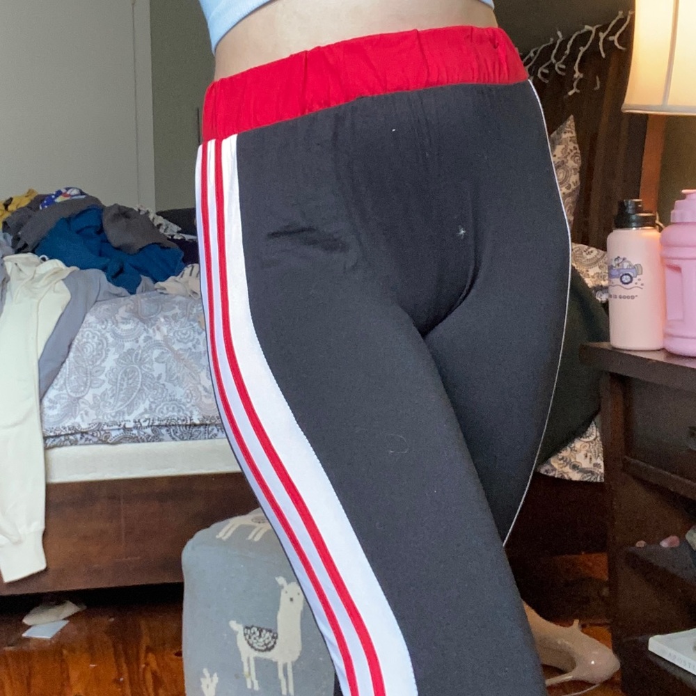 Black leggings with white and red stripes